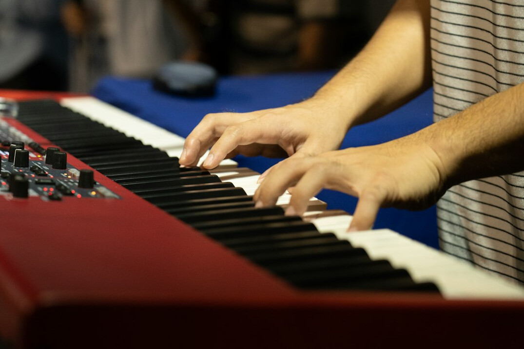 Close-up of hands typing on a laptop keyboard